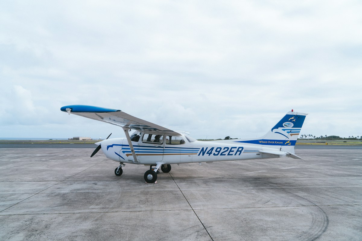 A small private airplane on an airport tarmac