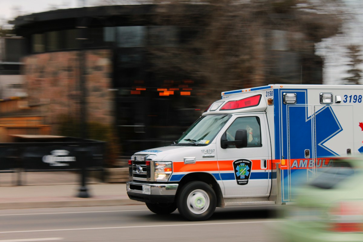 An ambulance traveling on the road