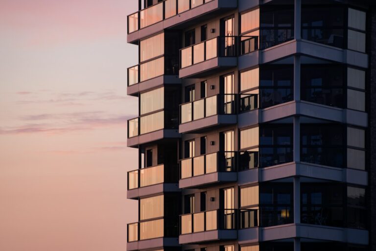 A modern apartment building with glass balconies
