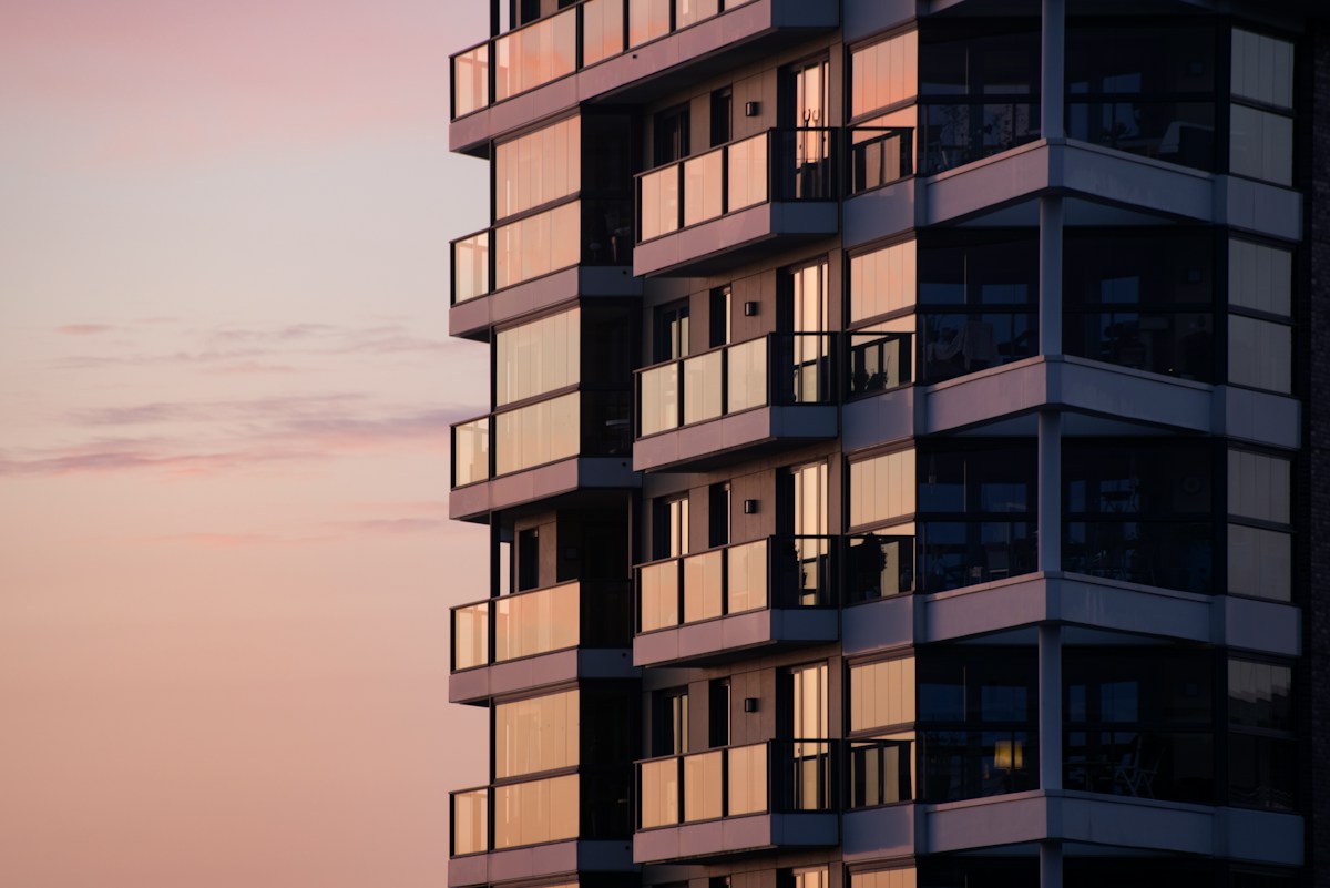 A modern apartment building with glass balconies