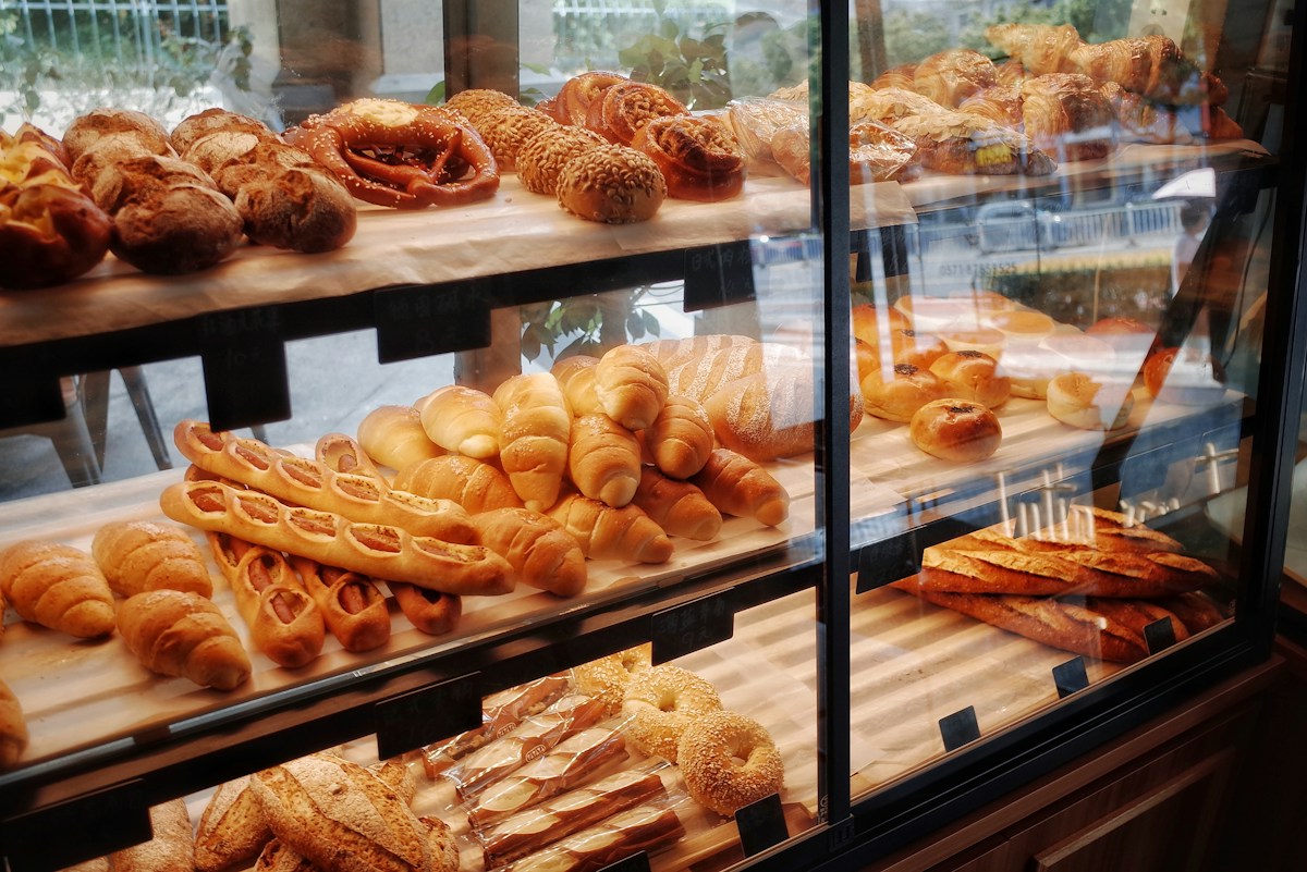 Breads in a bakery display shelf
