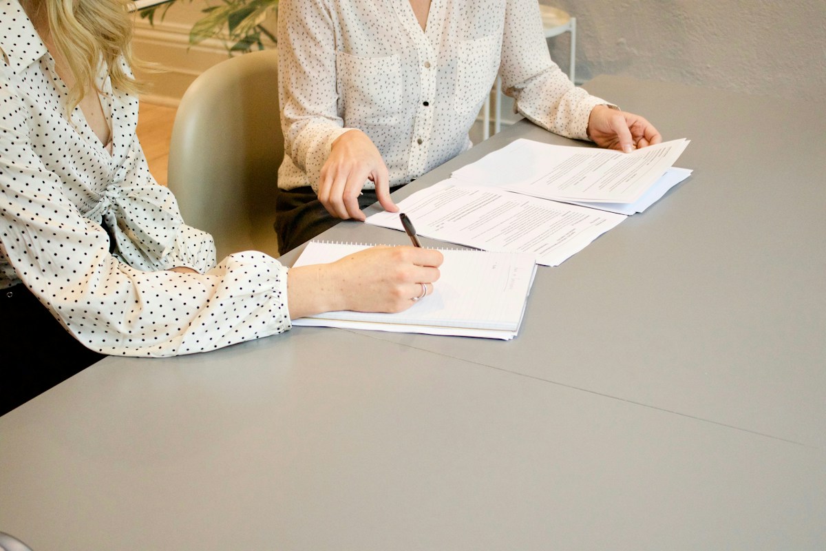 A woman signing a contract