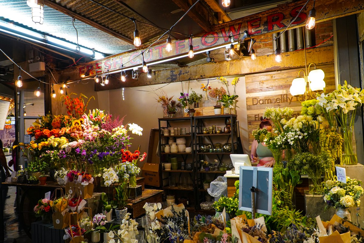 A flower shop filled with many types of flowers