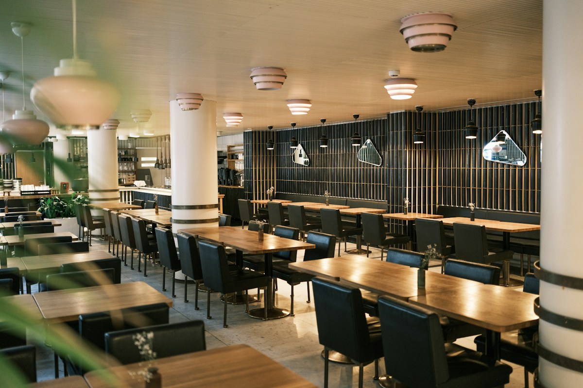 Empty modern restaurant interior with tables and chairs