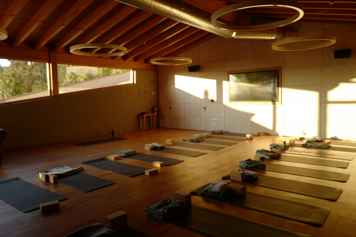 A yoga studio with mats on the floor
