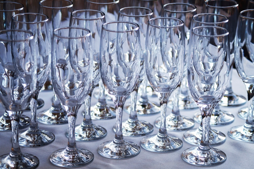 Rows of fine crystal stemware in bright light